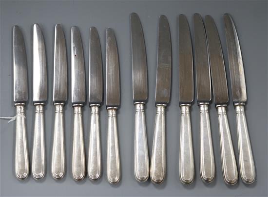 A set of six modern silver handled thread pattern table knives and six matching dessert knives, William Comyns & Sons Ltd, London.